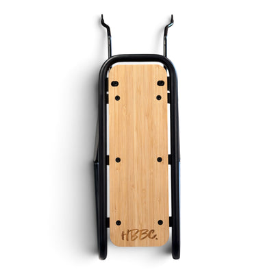 Top view of HBBC E-Cruiser rear rack showing natural-finish deck and HBBC logo